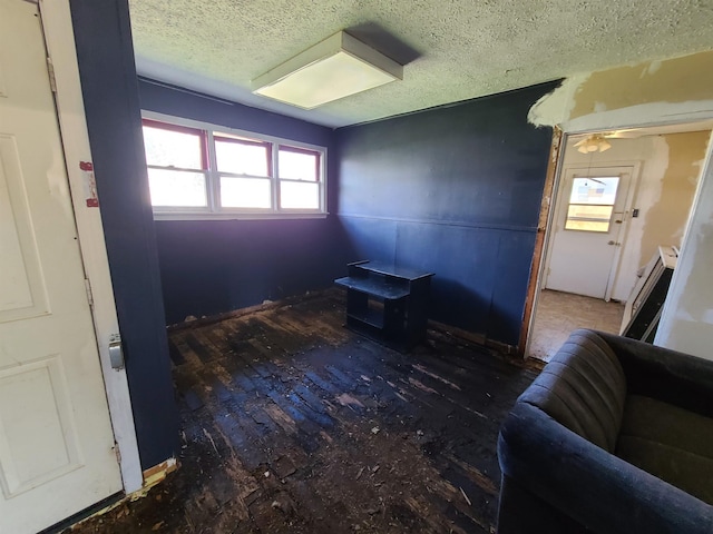 unfurnished room featuring a textured ceiling