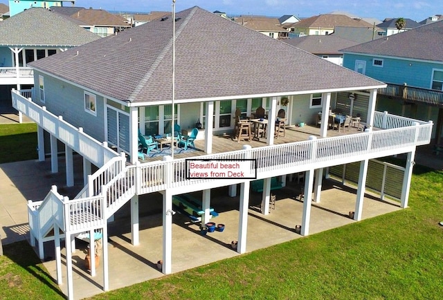 rear view of house featuring a patio and a wooden deck