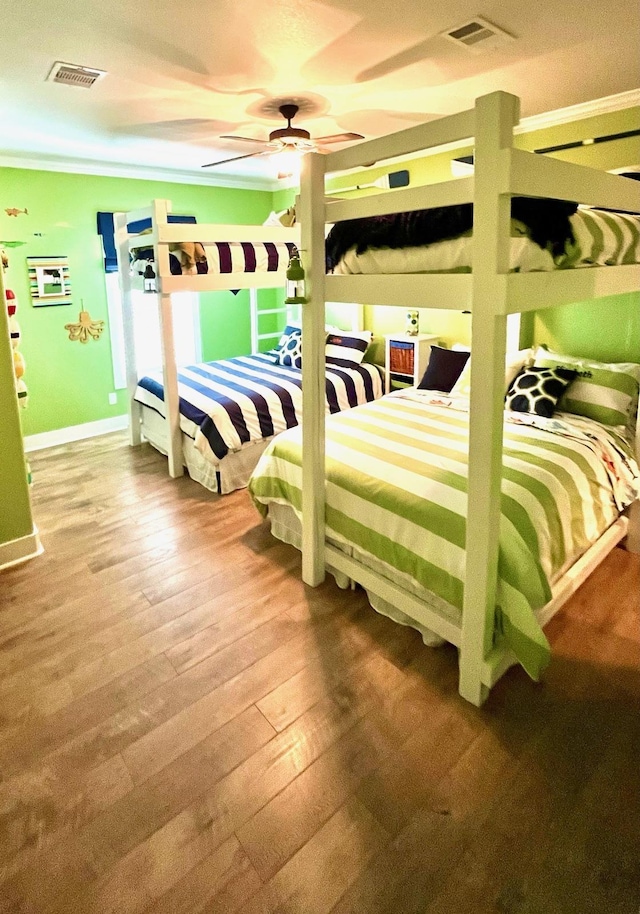 bedroom with hardwood / wood-style floors and ceiling fan