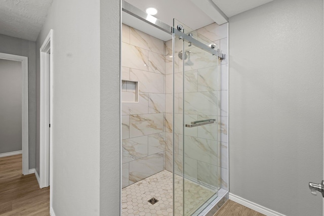 6425 Adams Blvd, Groves, TX 77619 - full bath with wood finished floors and a shower stall