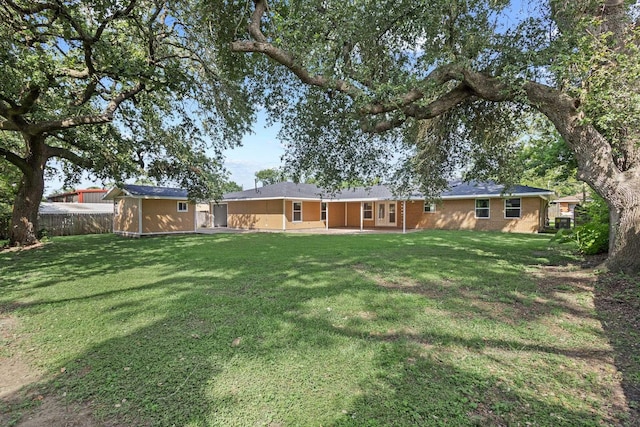 6425 Adams Blvd, Groves, TX 77619 - view of yard with a storage shed