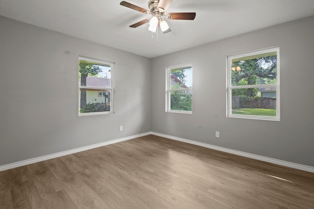 6425 Adams Blvd, Groves, TX 77619 - empty room with wood finished floors and ceiling fan