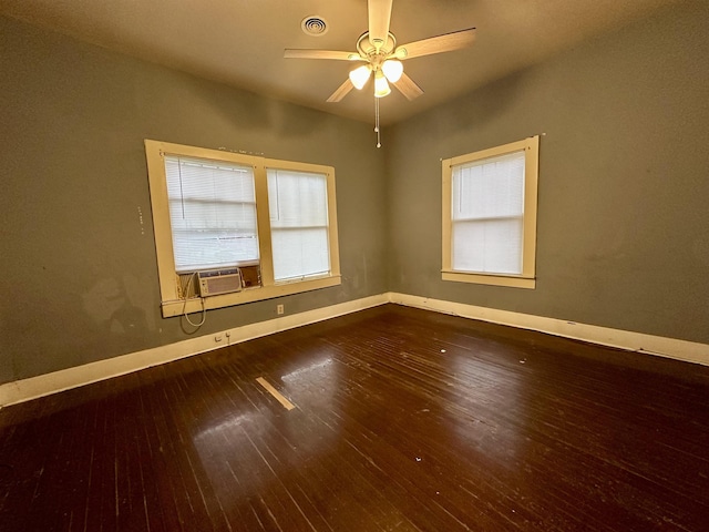 unfurnished room with hardwood / wood-style flooring, ceiling fan, a healthy amount of sunlight, and cooling unit