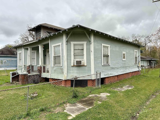 view of property exterior featuring a yard and cooling unit