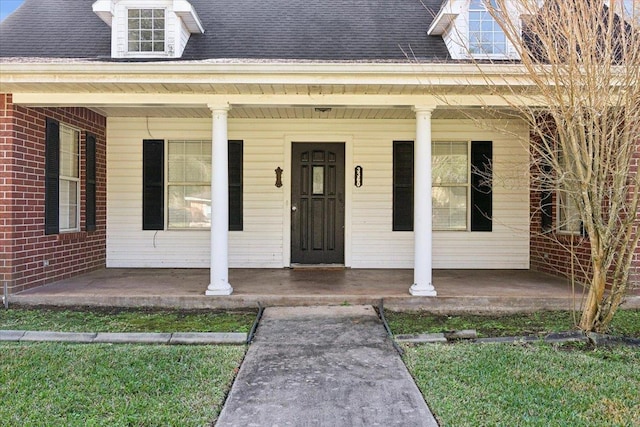 entrance to property with covered porch