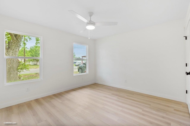 381 Perryman St, New Braunfels, TX 78130 - unfurnished room with baseboards, a healthy amount of sunlight, and light wood finished floors