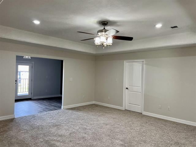 7600 Oakmont Dr, Port Arthur, TX 77642 - carpeted empty room featuring baseboards, a ceiling fan, recessed lighting, and a tray ceiling