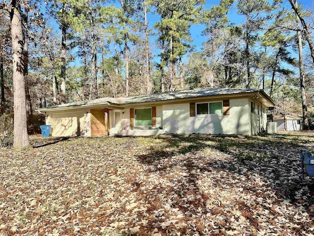 single story home featuring central AC