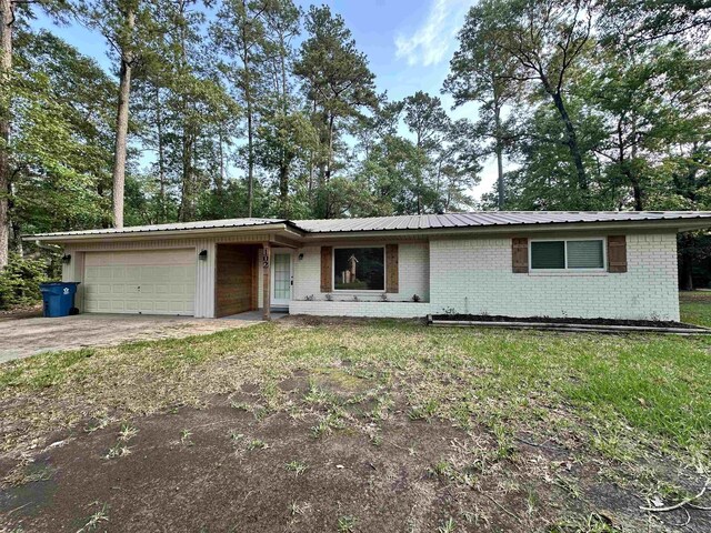 102 Ash Ln, Village Mills, TX 77663 - single story home featuring a garage and brick siding