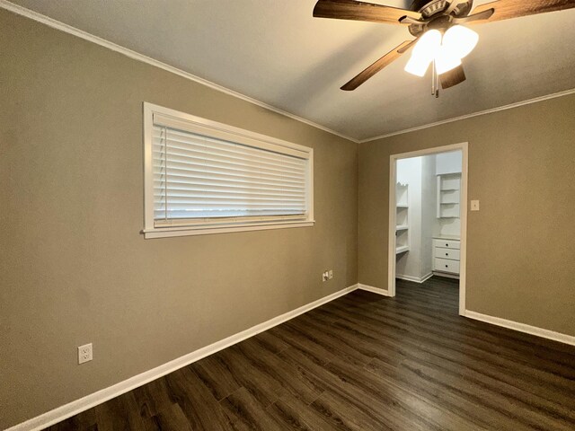 102 Ash Ln, Village Mills, TX 77663 - unfurnished bedroom with crown molding, baseboards, a ceiling fan, and dark wood-style flooring