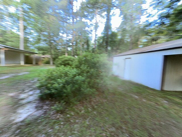 102 Ash Ln, Village Mills, TX 77663 - view of landscape with a forest view