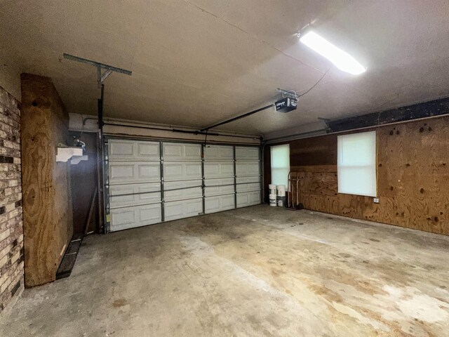 102 Ash Ln, Village Mills, TX 77663 - garage with a garage door opener