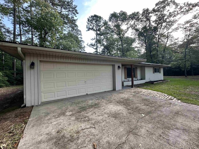 102 Ash Ln, Village Mills, TX 77663 - single story home with an attached garage and concrete driveway