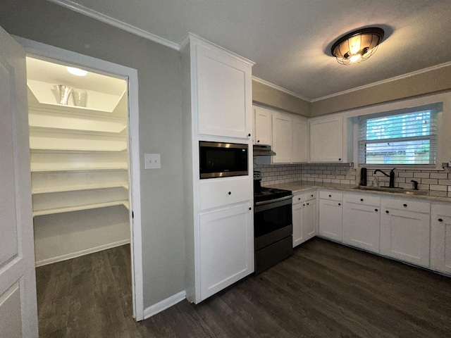 102 Ash Ln, Village Mills, TX 77663 - kitchen with crown molding, electric range oven, built in microwave, a sink, and dark wood finished floors