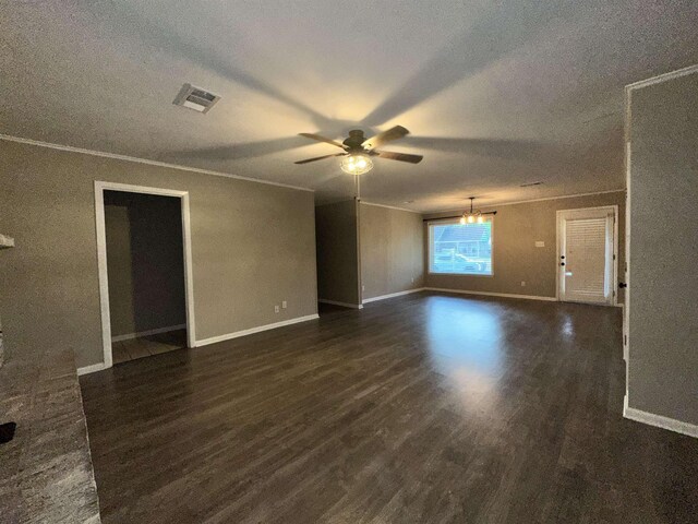 102 Ash Ln, Village Mills, TX 77663 - empty room featuring a textured ceiling, visible vents, dark wood finished floors, baseboards, and ceiling fan with notable chandelier