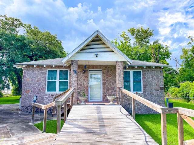 3832 W Park Ave, Orange, TX 77630 - view of front of property with stone siding and a wooden deck