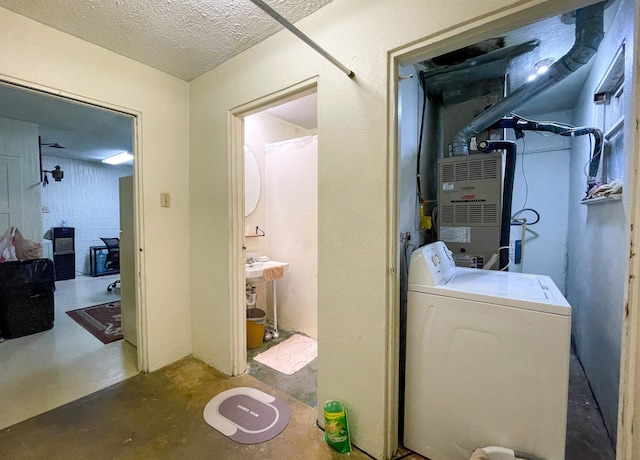 3832 W Park Ave, Orange, TX 77630 - washroom featuring washer / dryer, a textured ceiling, and concrete block wall