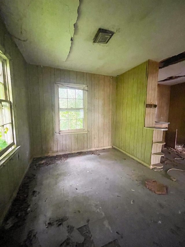 3832 W Park Ave, Orange, TX 77630 - spare room featuring wood walls