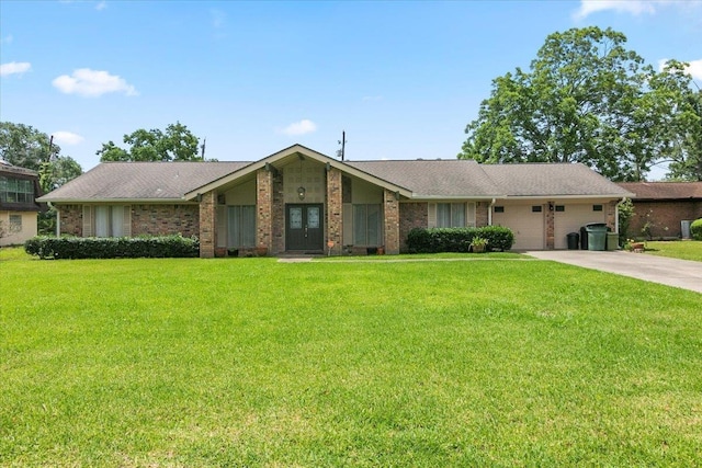 single story home featuring a garage and a front yard