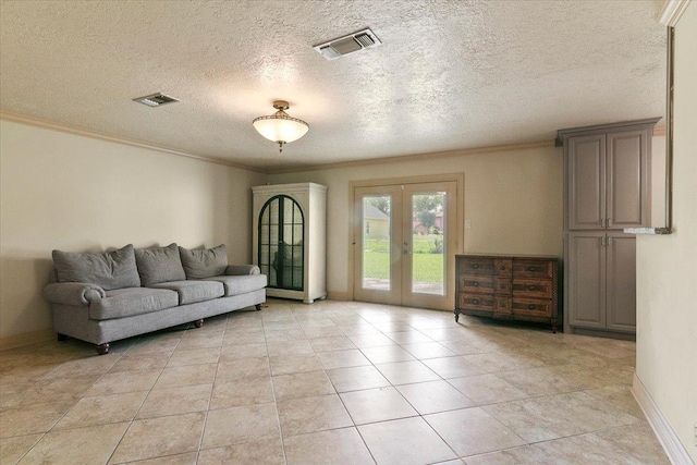 living room featuring french doors, light tile patterned flooring, a textured ceiling, and ornamental molding