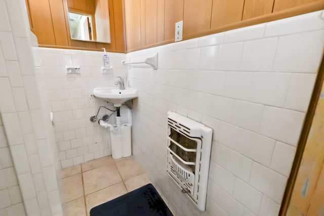 bathroom featuring tile patterned flooring and heating unit