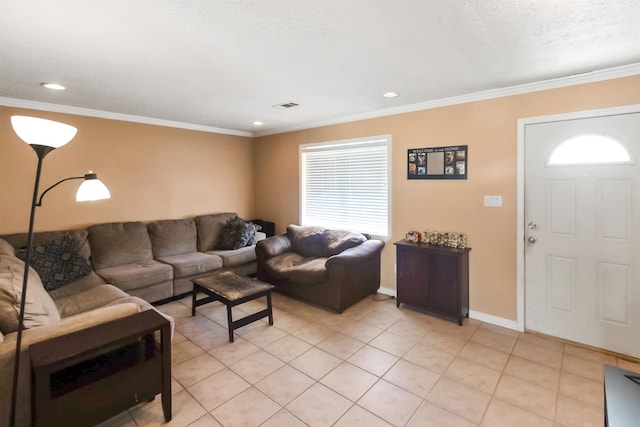 living room featuring light tile patterned floors, a textured ceiling, and ornamental molding