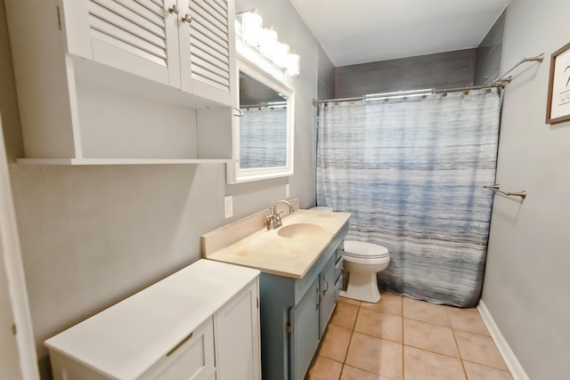 bathroom with tile patterned flooring, vanity, toilet, and curtained shower