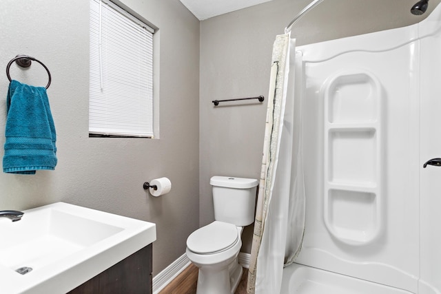 446 Piney Point Dr, Sour Lake, TX 77659 - full bath with vanity, toilet, a shower with shower curtain, and baseboards