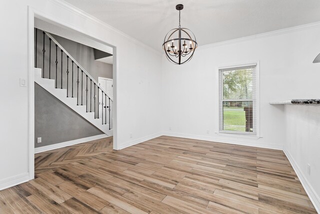 446 Piney Point Dr, Sour Lake, TX 77659 - empty room featuring baseboards, stairs, ornamental molding, wood finished floors, and a notable chandelier