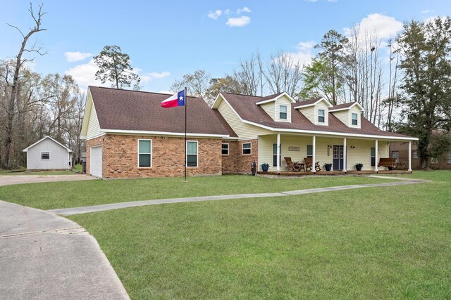 446 Piney Point Dr, Sour Lake, TX 77659 - cape cod home featuring covered porch, a front yard, a garage, and roof with shingles