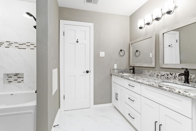 446 Piney Point Dr, Sour Lake, TX 77659 - bathroom featuring double vanity, a bath, marble finish floor, and a sink