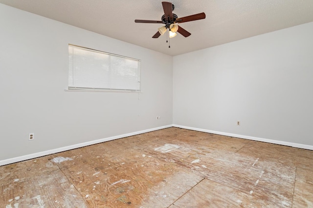 unfurnished room with ceiling fan