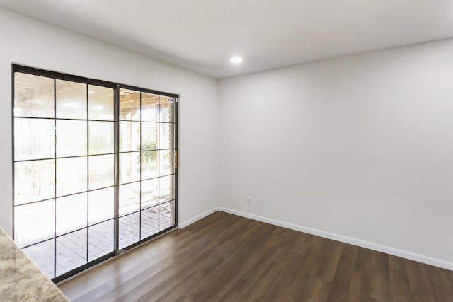 empty room featuring dark hardwood / wood-style floors