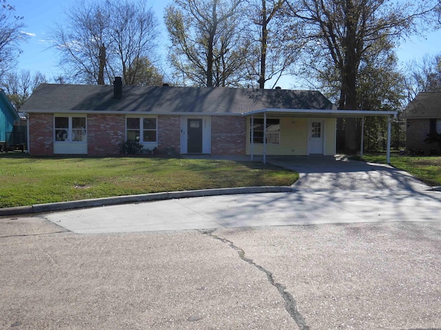 single story home featuring a front yard and a carport