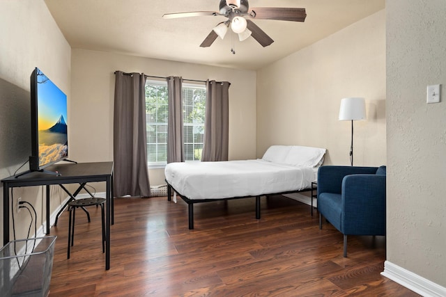 10775 Old Voth Rd, Beaumont, TX 77713 - bedroom featuring wood finished floors, a textured wall, baseboards, and ceiling fan