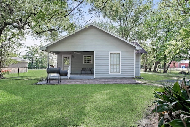 10775 Old Voth Rd, Beaumont, TX 77713 - rear view of house featuring a ceiling fan and a porch