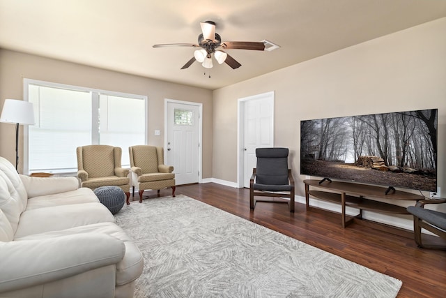 10775 Old Voth Rd, Beaumont, TX 77713 - living area with a ceiling fan, dark wood-type flooring, and baseboards