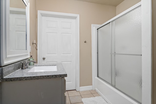 10775 Old Voth Rd, Beaumont, TX 77713 - full bath featuring tile patterned flooring, vanity, and bath / shower combo with glass door