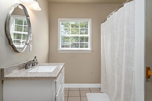 10775 Old Voth Rd, Beaumont, TX 77713 - full bathroom featuring tile patterned flooring, vanity, and baseboards