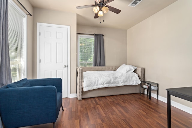 10775 Old Voth Rd, Beaumont, TX 77713 - bedroom with dark wood-style flooring, baseboards, and ceiling fan