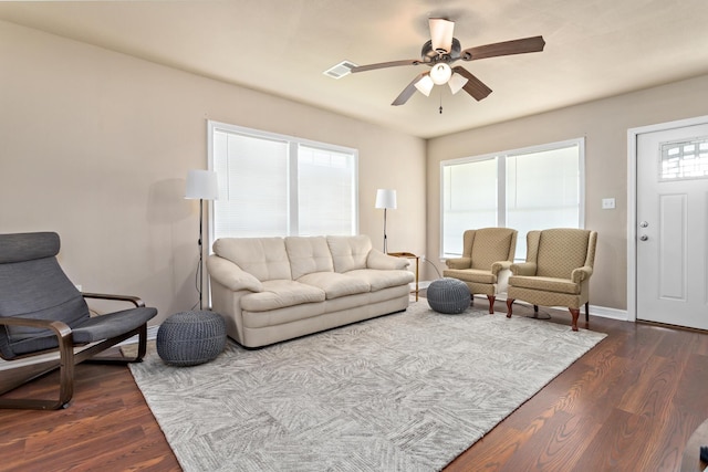 10775 Old Voth Rd, Beaumont, TX 77713 - living room with a ceiling fan, dark wood-style floors, and baseboards