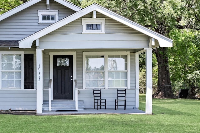 10775 Old Voth Rd, Beaumont, TX 77713 - view of front of property with a front lawn and covered porch