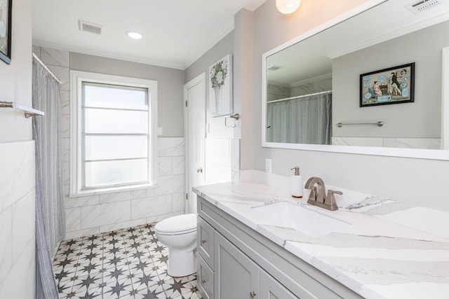 bathroom featuring crown molding, vanity, and toilet