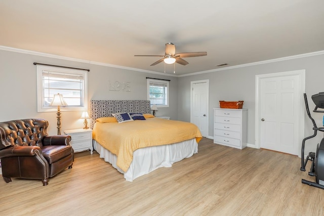 bedroom featuring light hardwood / wood-style floors, ceiling fan, and crown molding