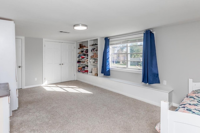 unfurnished bedroom with light carpet