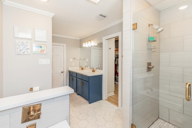 bathroom with vanity, tile patterned floors, walk in shower, and crown molding