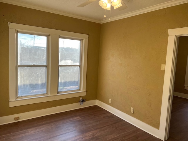 spare room with baseboards, a textured wall, ceiling fan, ornamental molding, and dark wood-style flooring