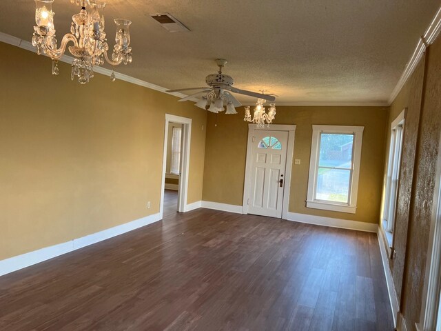 entrance foyer featuring dark wood-style floors, visible vents, crown molding, and baseboards