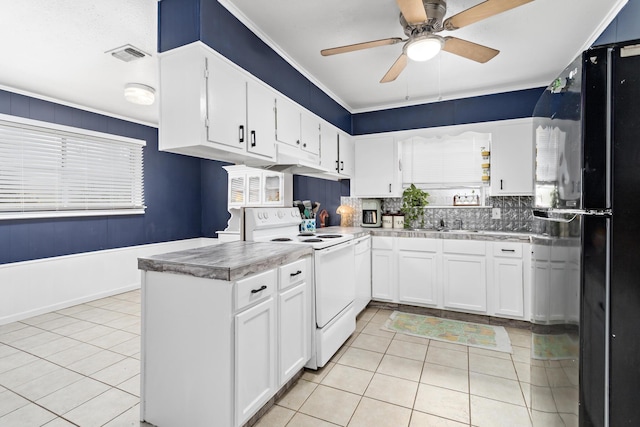 kitchen featuring white cabinetry, electric range, ceiling fan, black refrigerator, and light tile patterned flooring