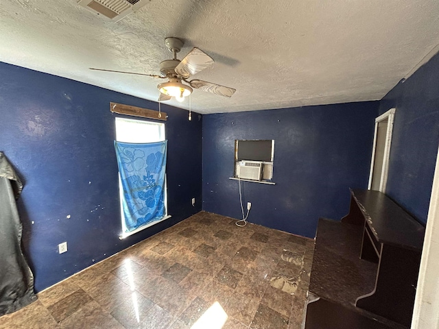 138 Ned Rd, Lumberton, TX 77657 - spare room with ceiling fan, a textured ceiling, tile patterned floors, and cooling unit